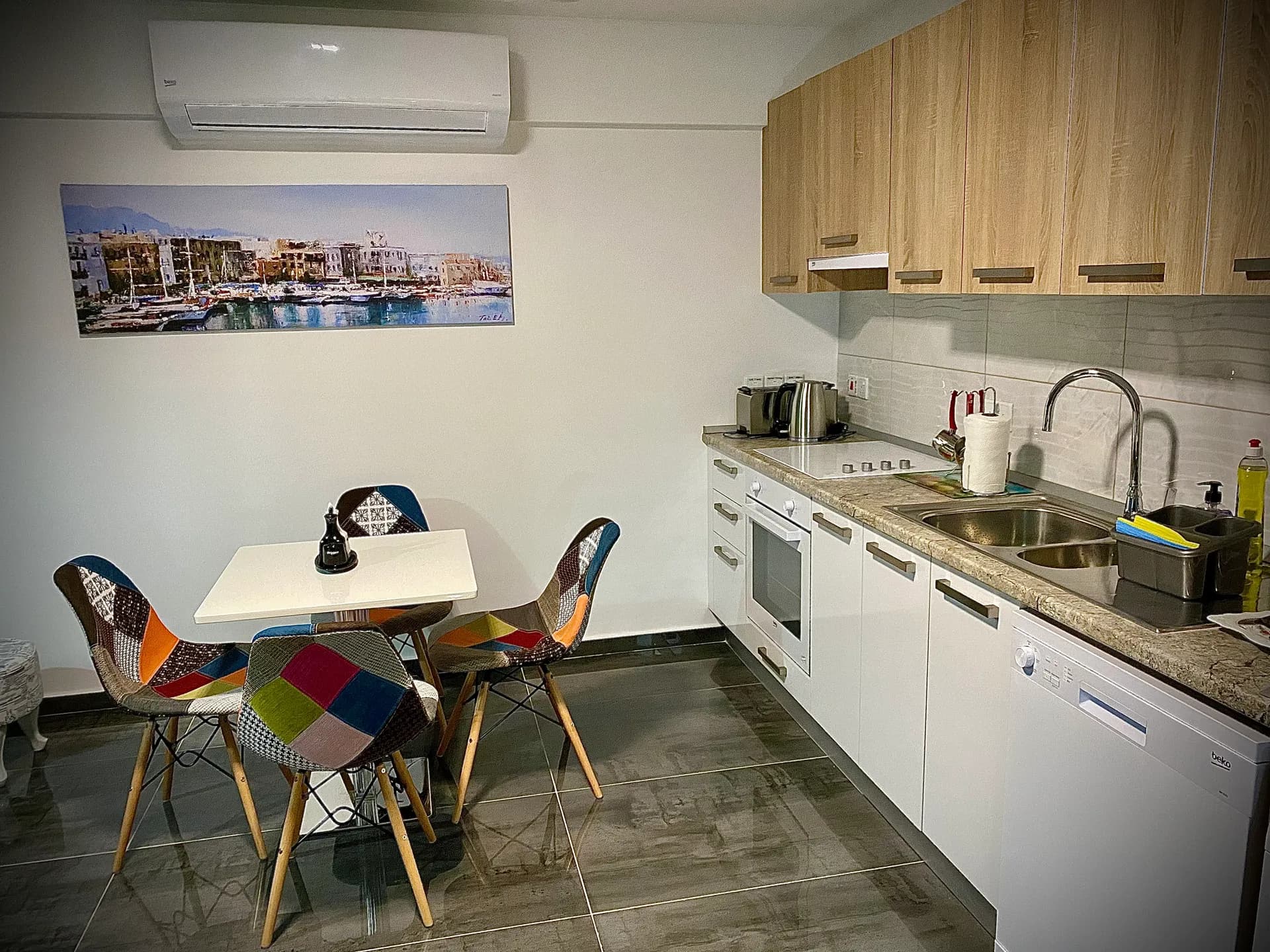 Kitchen — oven, hob and dining table