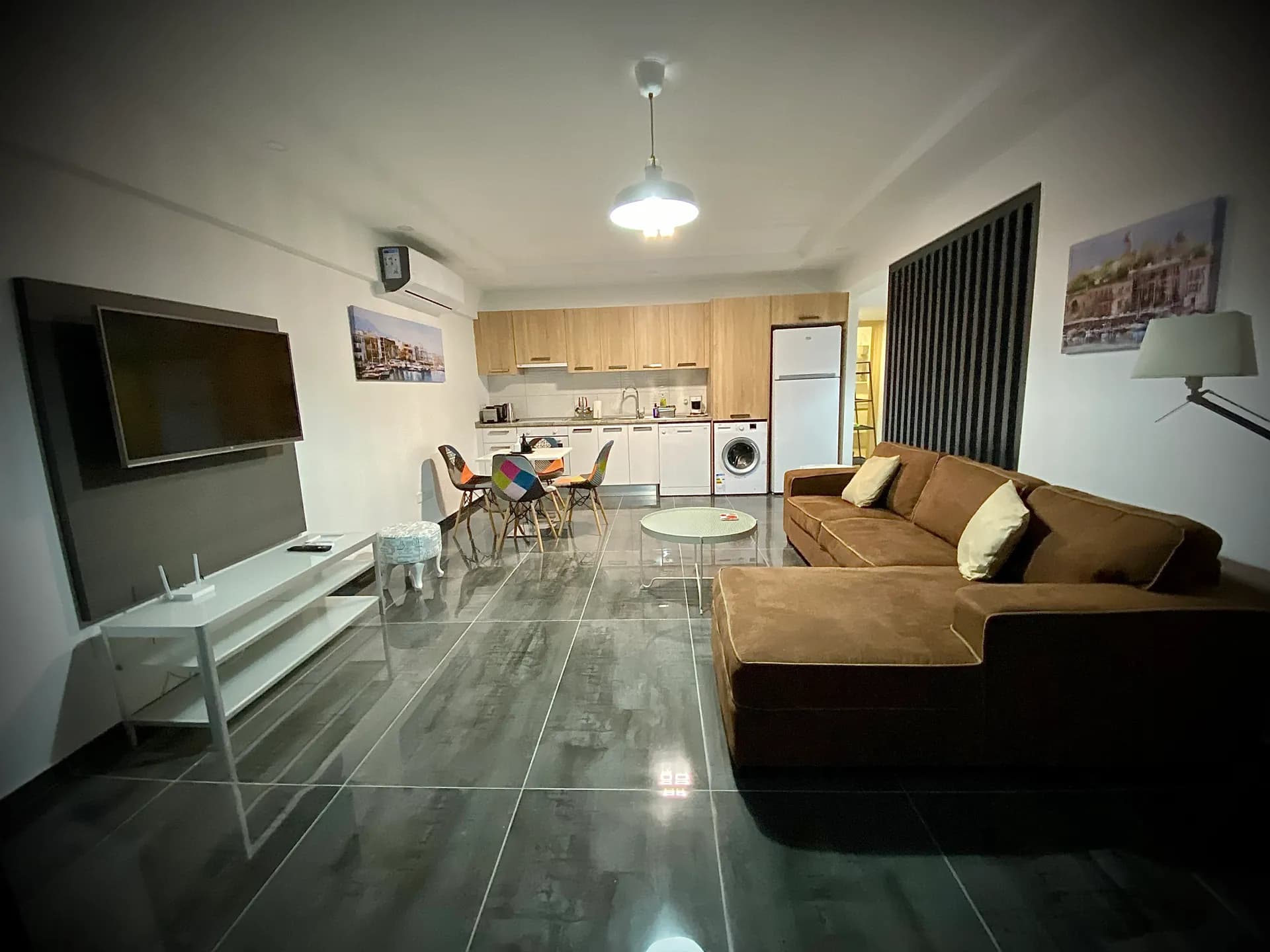 Studio overview — living area, kitchen and dining table