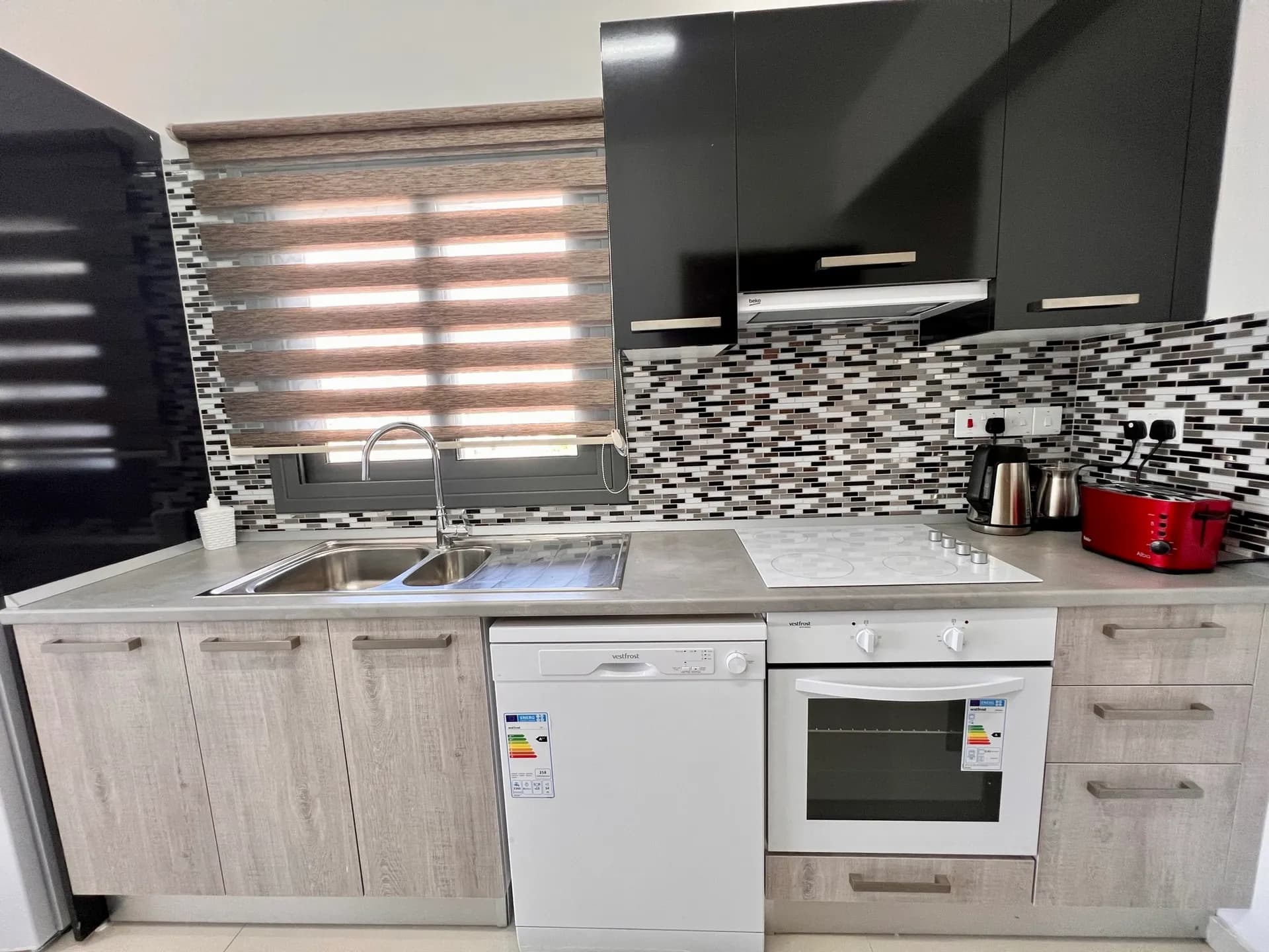Fully equipped kitchen — oven, hob and dishwasher