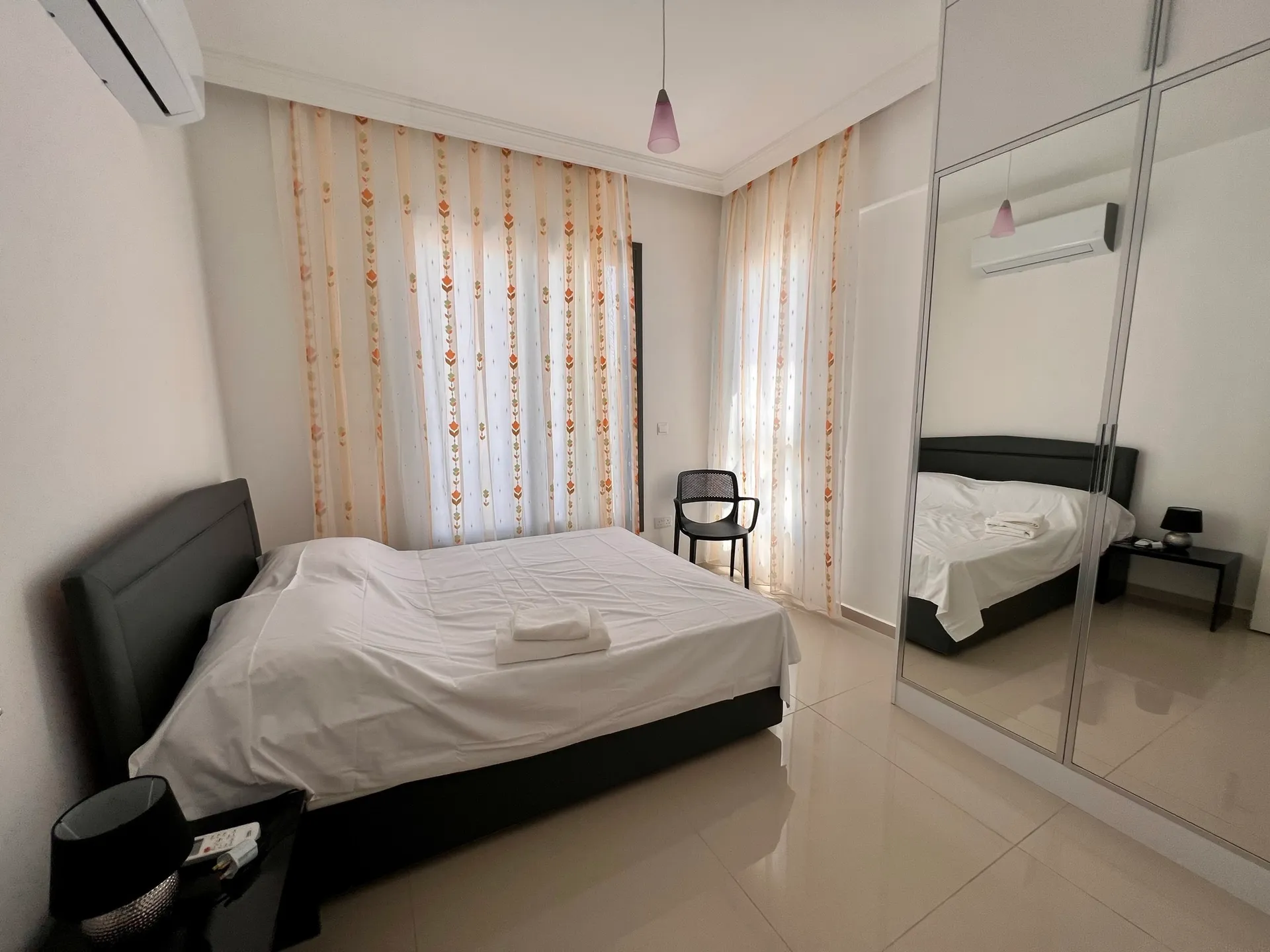 Bedroom — double bed and mirrored wardrobe